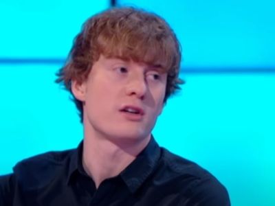 James Acaster is wearing a black shirt in the picture.